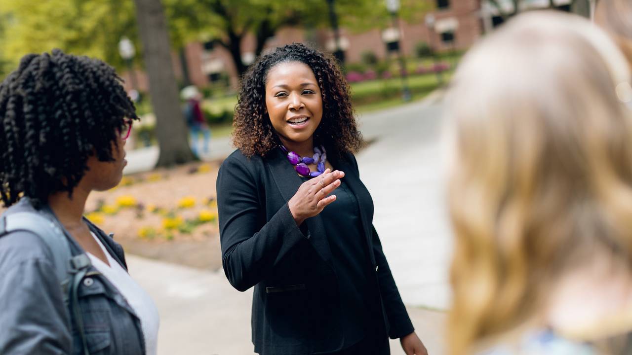 Nicole speaking to students